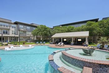 Resort style pool with spa and tanning ledge